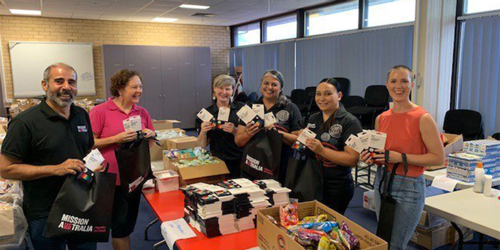 Mission Australia teams packing Recovery Kits to give to the community in South East Queensland. 