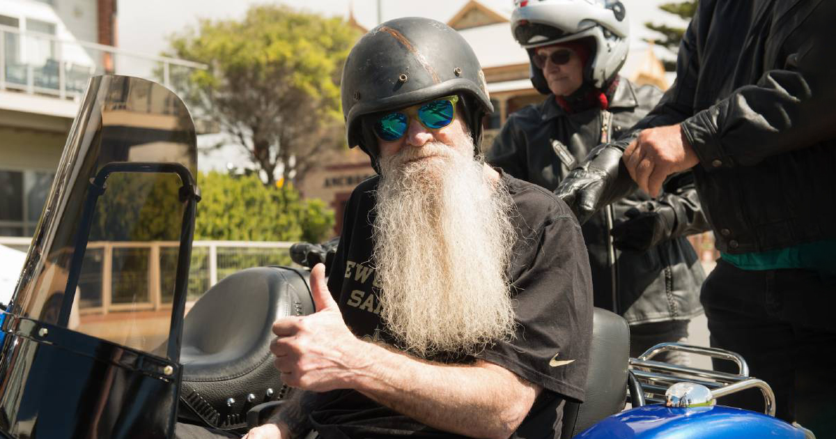 Terry gives a thumbs up from the side car of the Harley Davidson