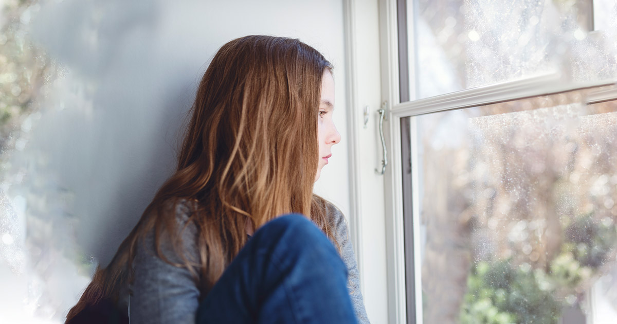 Young lady is stayng at home looking worried