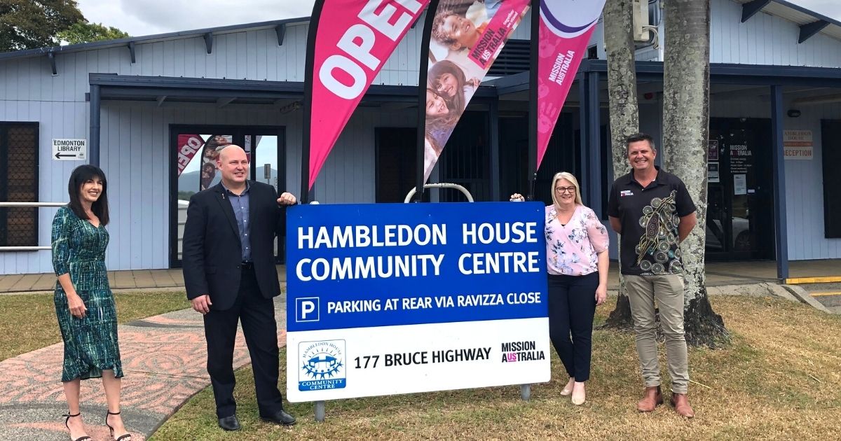 People standing outside Hambledon House smiling on opening day