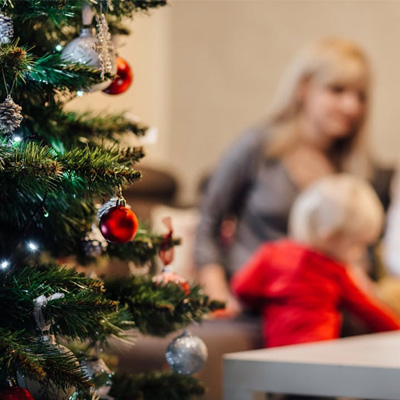 Child with parents at Christmas