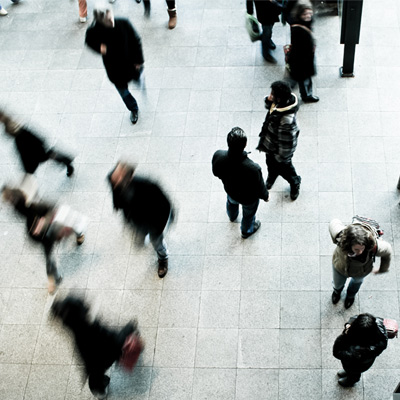 People walking around in a crowd