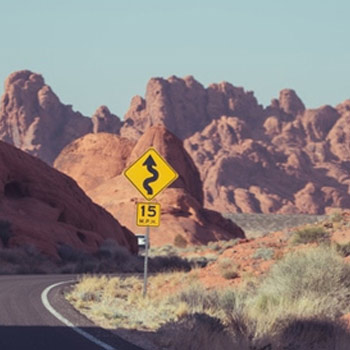 Windy road with sign