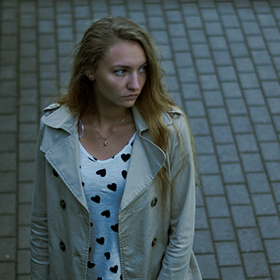 Woman walking along a street