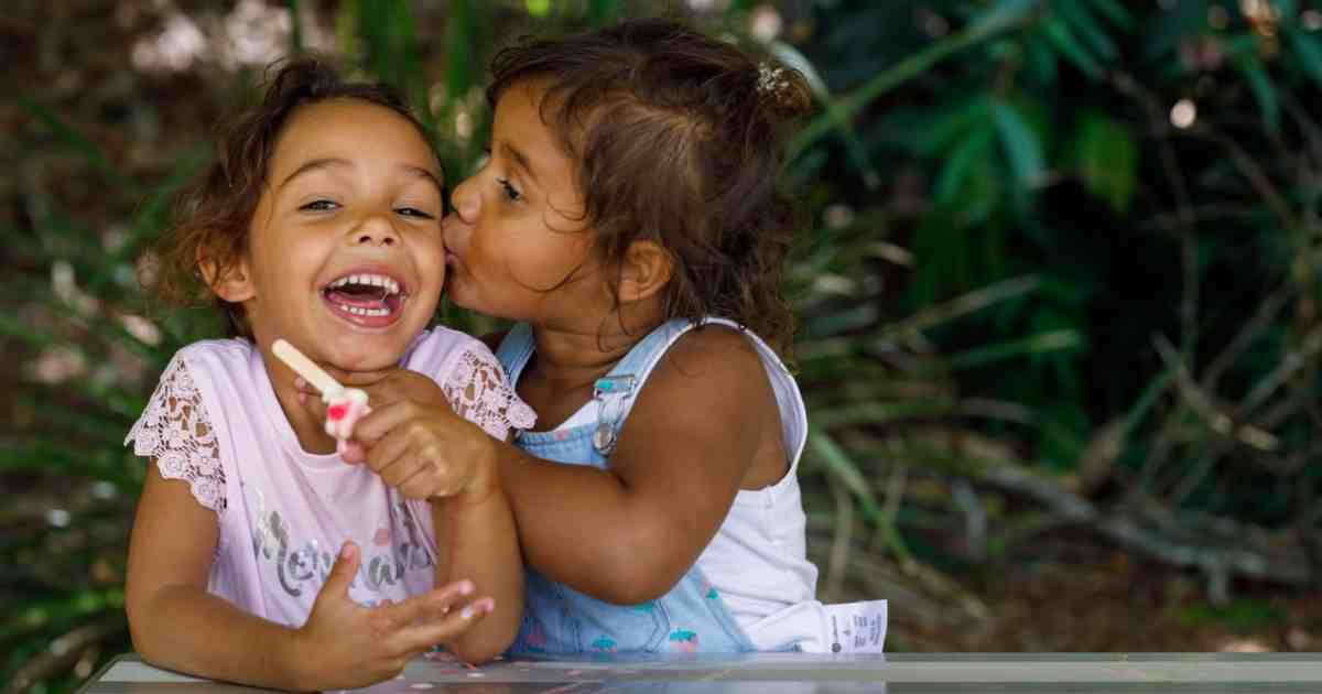 Indigenous children hugging