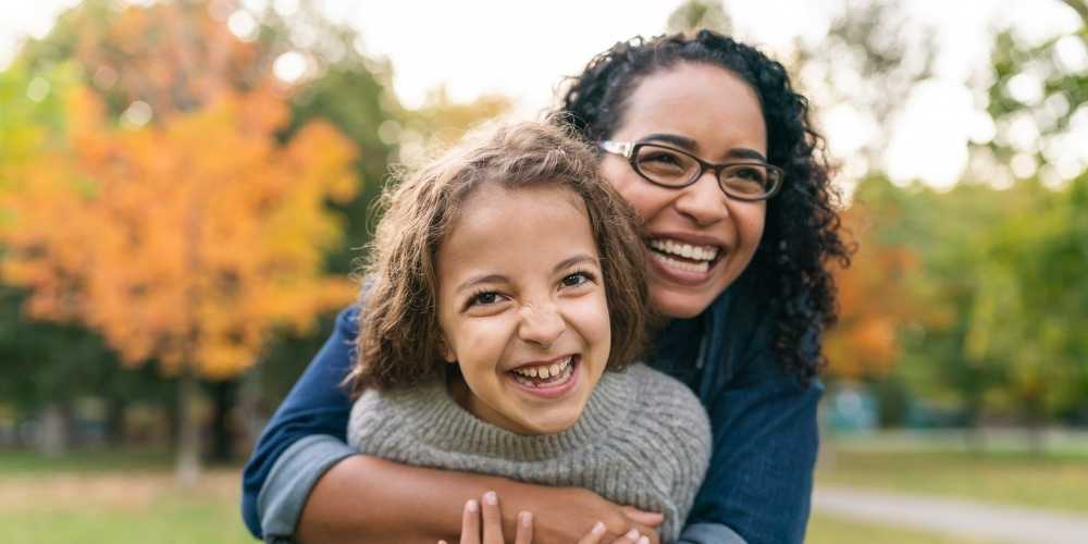 Mother hugging daughter1