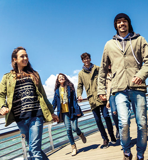 A group of youth looking happy together.