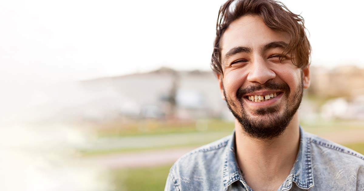 Young man happy in park