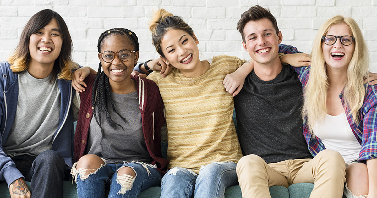 group of youth looking happy and positive