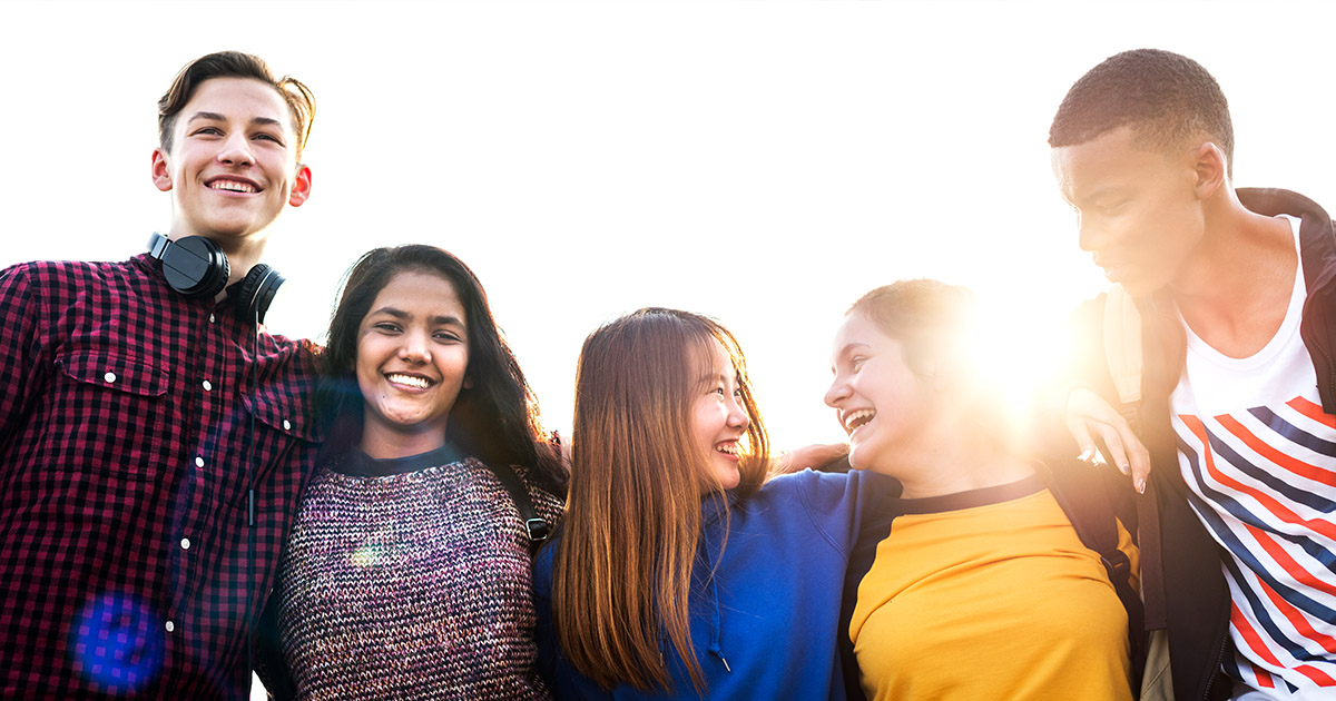 group of youth looking happy and positive