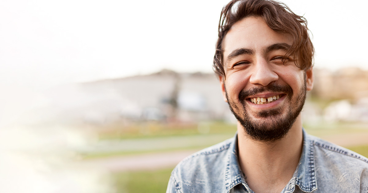 Young man happy at park