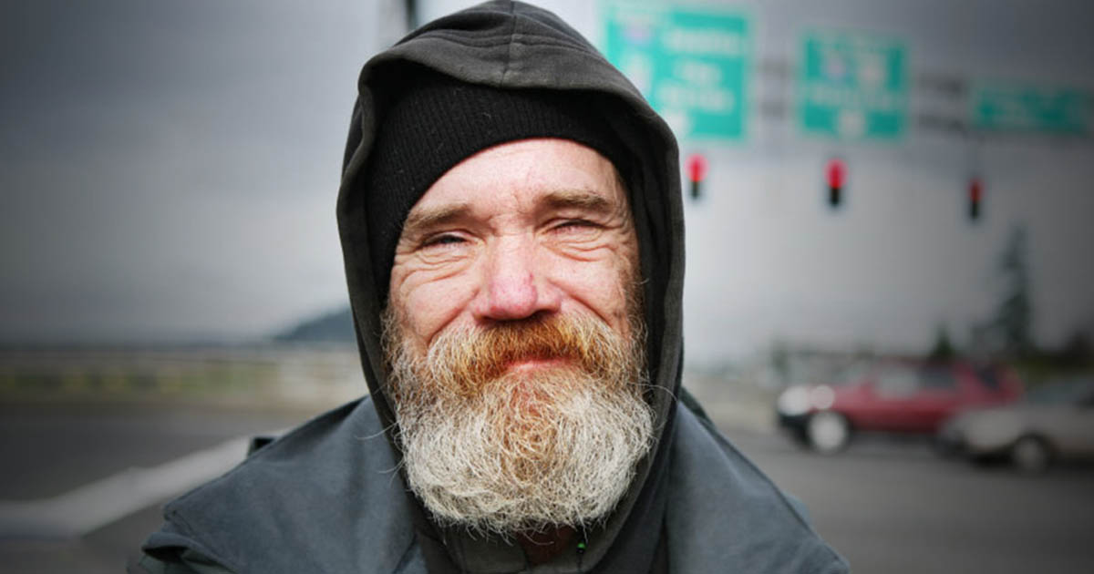 Homeless man looking hopeful