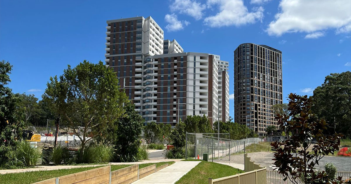 a newly built building of Midtown macpark surrounded by trees