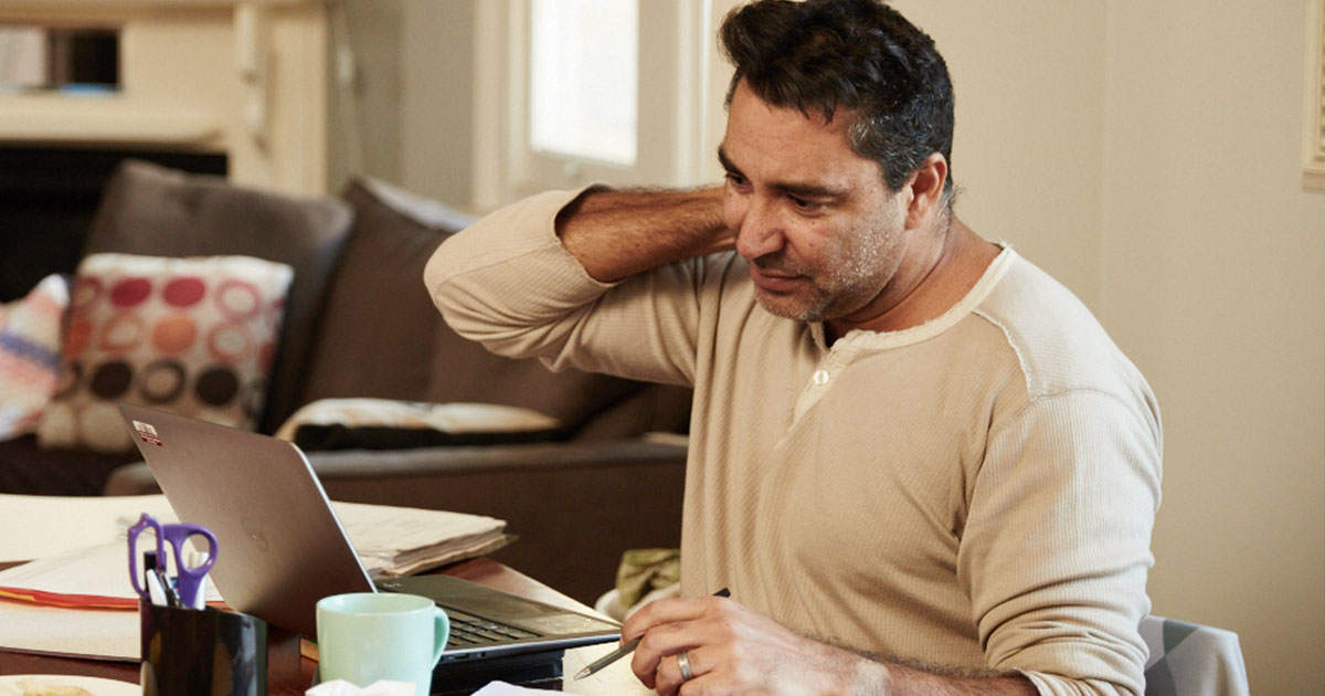 A worried father on his computer