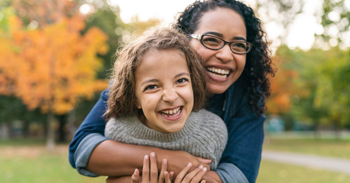 Mum and daughter looking happy