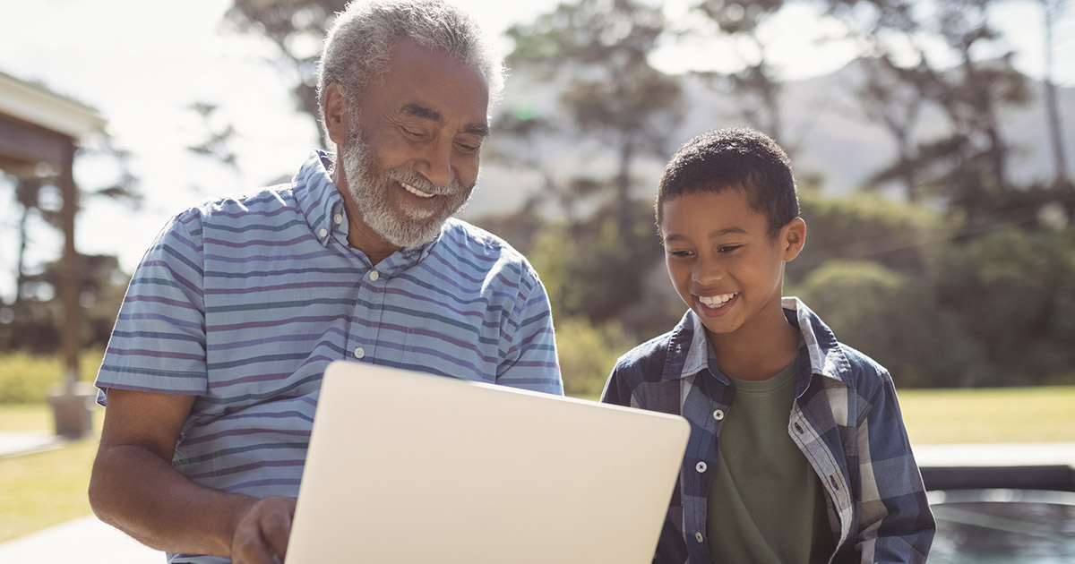 Grandpa with grandson on their computer