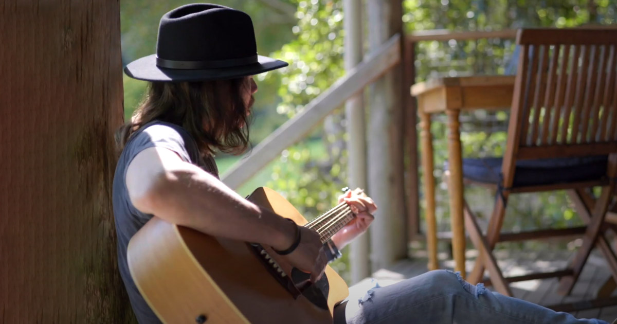 Benny Black is playing his guitar