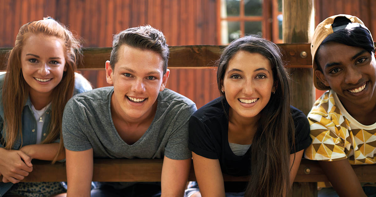 group of youth looking happy and positive