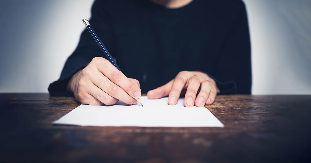 A man writing a letter.