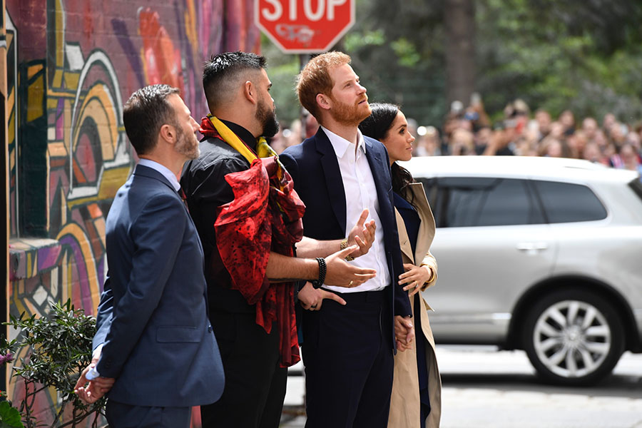 The Duke and Duchess looking at the Mural on the wall