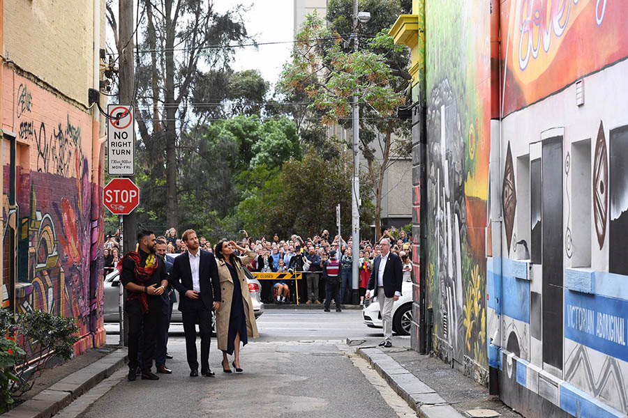 The Duke and Duchess looking at the Mural on the wall