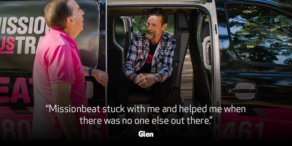Man sitting in the Missionbeat van talking to Missionbeat staff. Text on the image: “Missionbeat stuck with me and helped me when there was no one else out there.” - Glen 