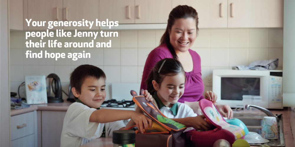 Jenny packs school lunches for her two children, Michael and Sora in their new kitchen. 