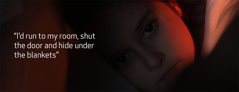 Girl sleeping on her mother’s lap with text that reads, “I’d run to my room, shut the door and hide under the blankets"