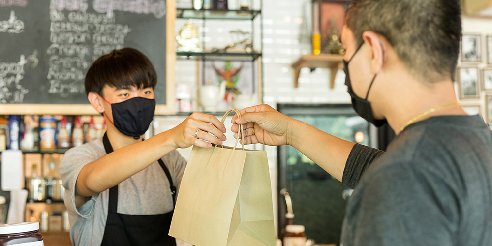 customer ordering takeway from a cafe