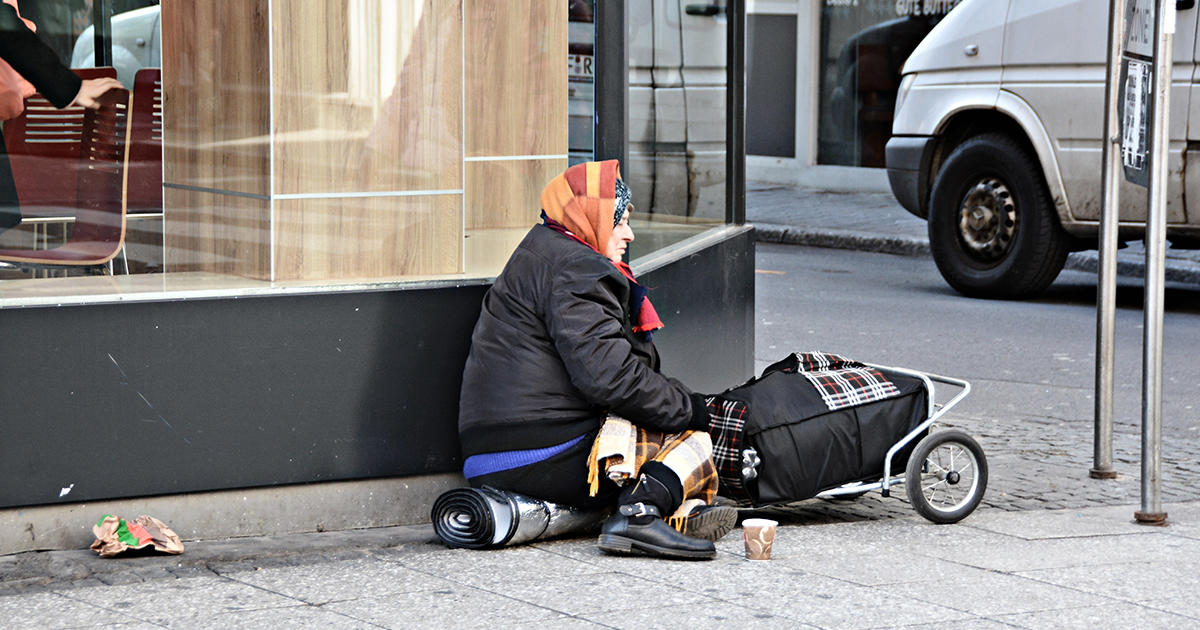 Homeless lady son the side of the road