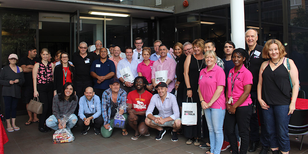 Group of people smiling in front of the MAC Surry Hills, Sydney 