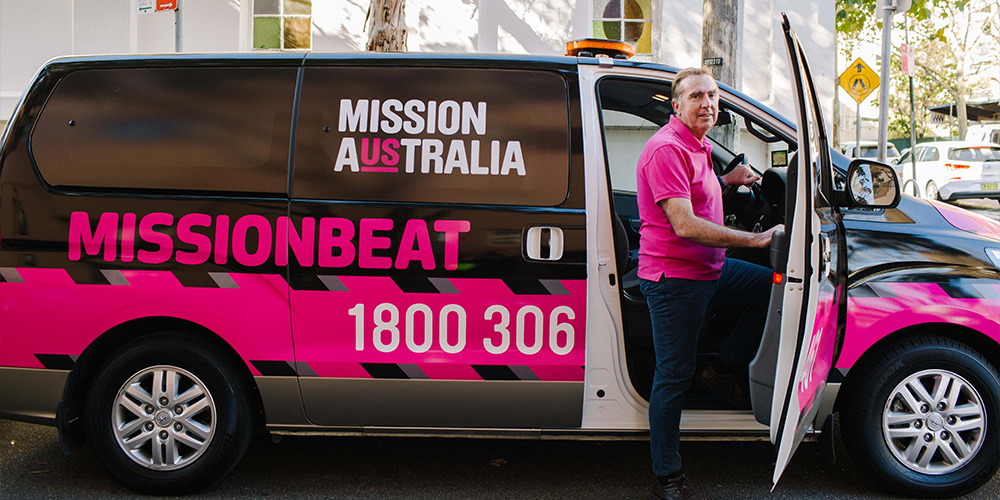 A man exiting the Missionbeat van.