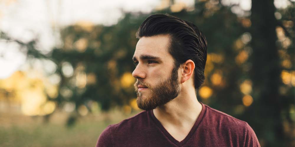 Young man outdoors looking into the distance