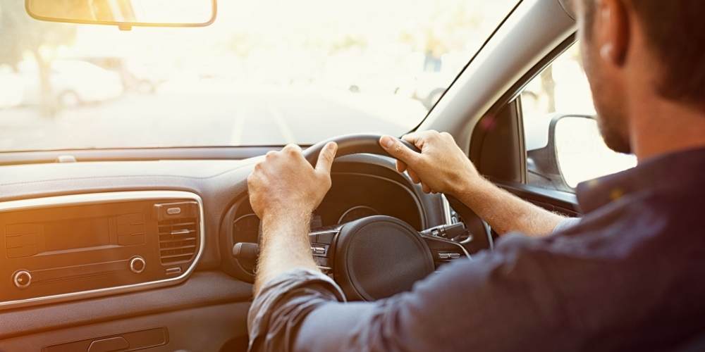 A man driving a car.