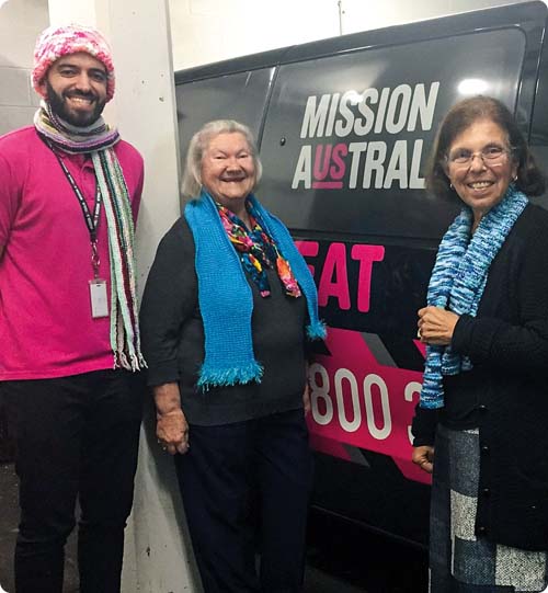 Missionbeat team wearing knitted scarves