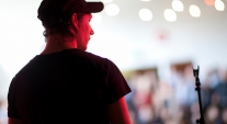 A boy playing in front of a crowd at CYI