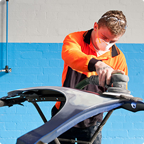 A man completing auto repairs