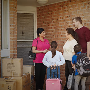 A man sending his two boys off to school